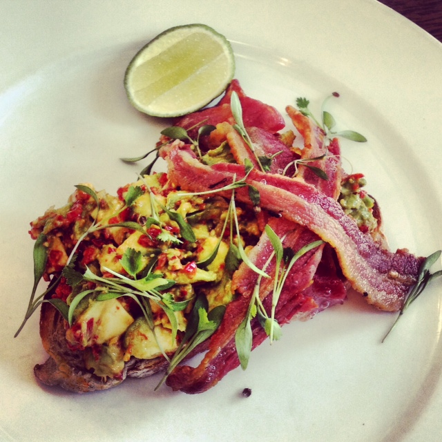 Avocado on toast with smoked streaky bacon
