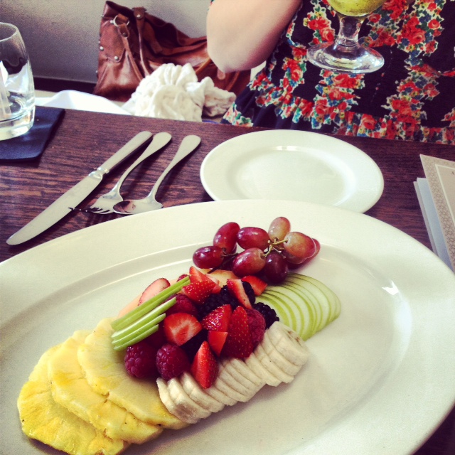 Fruit plate with yoghurt, toasted seeds and honey