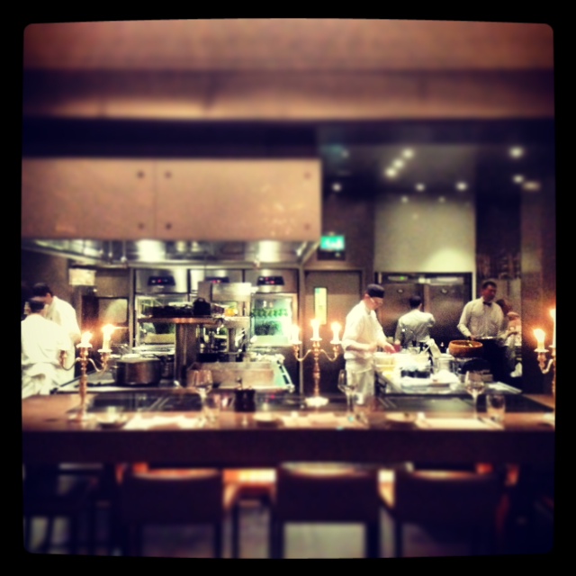 Beautiful open kitchen lit by candelabras..
