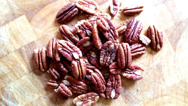 A large handful of pecan nuts