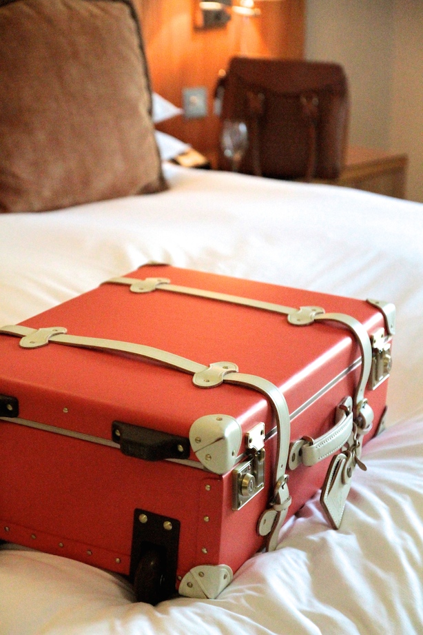 My Steamline Luggage suitcase on my very comfortable bed...