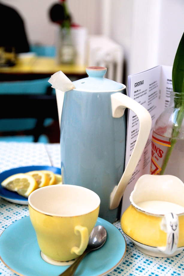 Tea pot and yellow cups