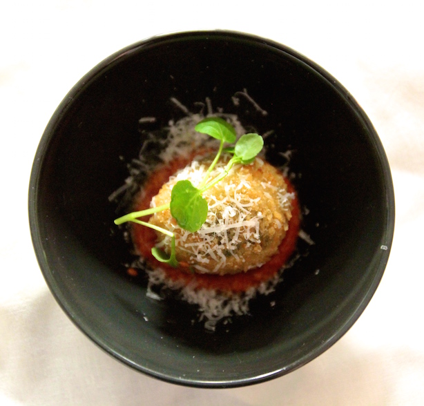 Spinach, chestnut and blue cheese arancini on a smoked tomato sauce